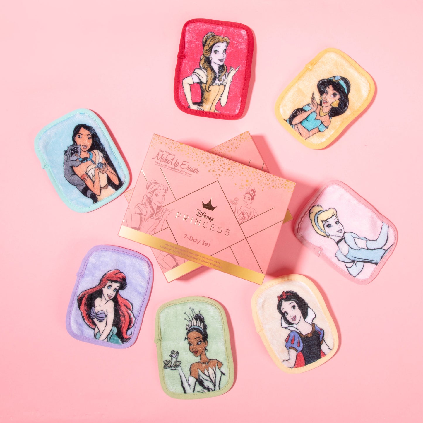 Ultimate Disney Princess 7-Day Set MakeUp Eraser cloths laying in a circle next to packaging. 